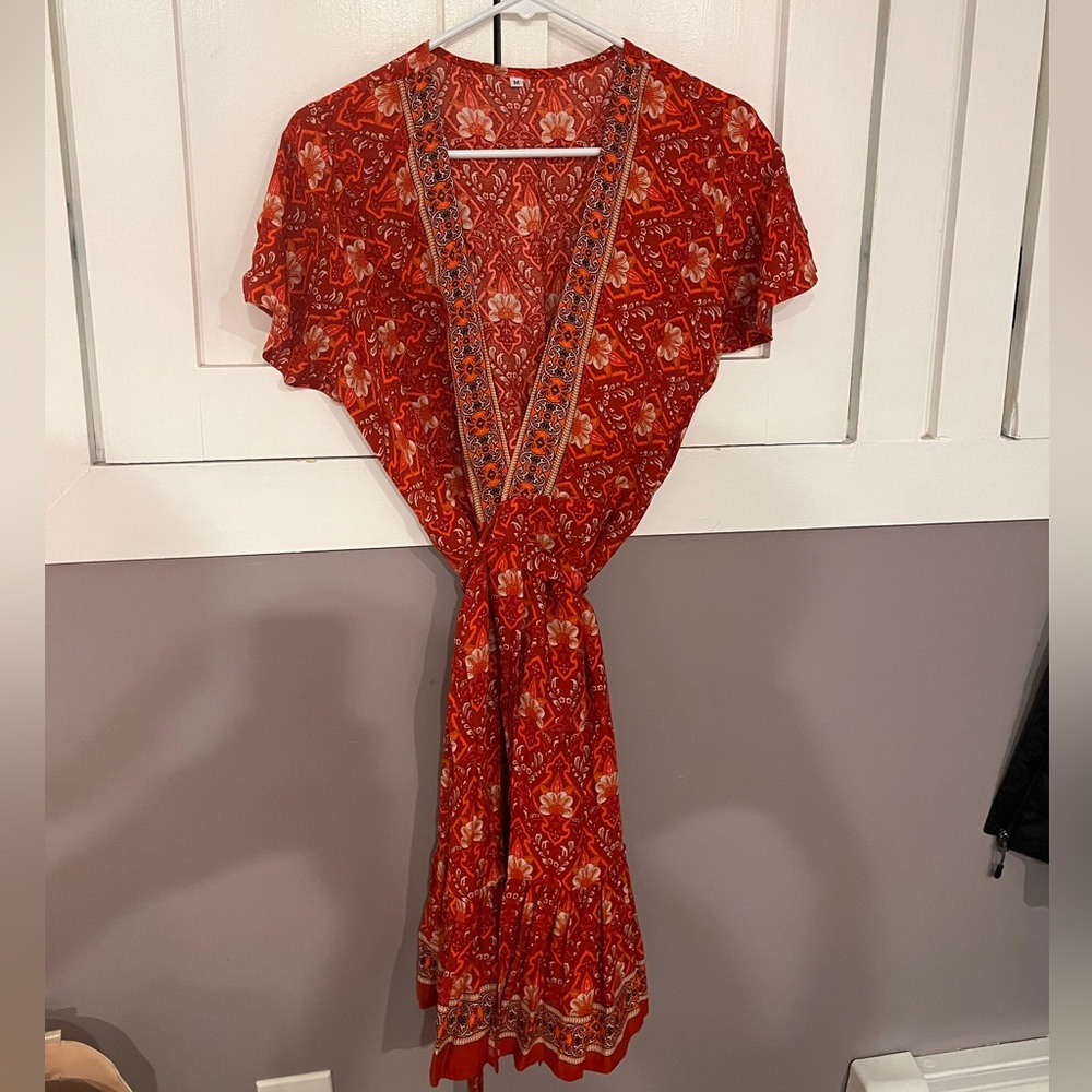 This is a medium wrap around knee length dress